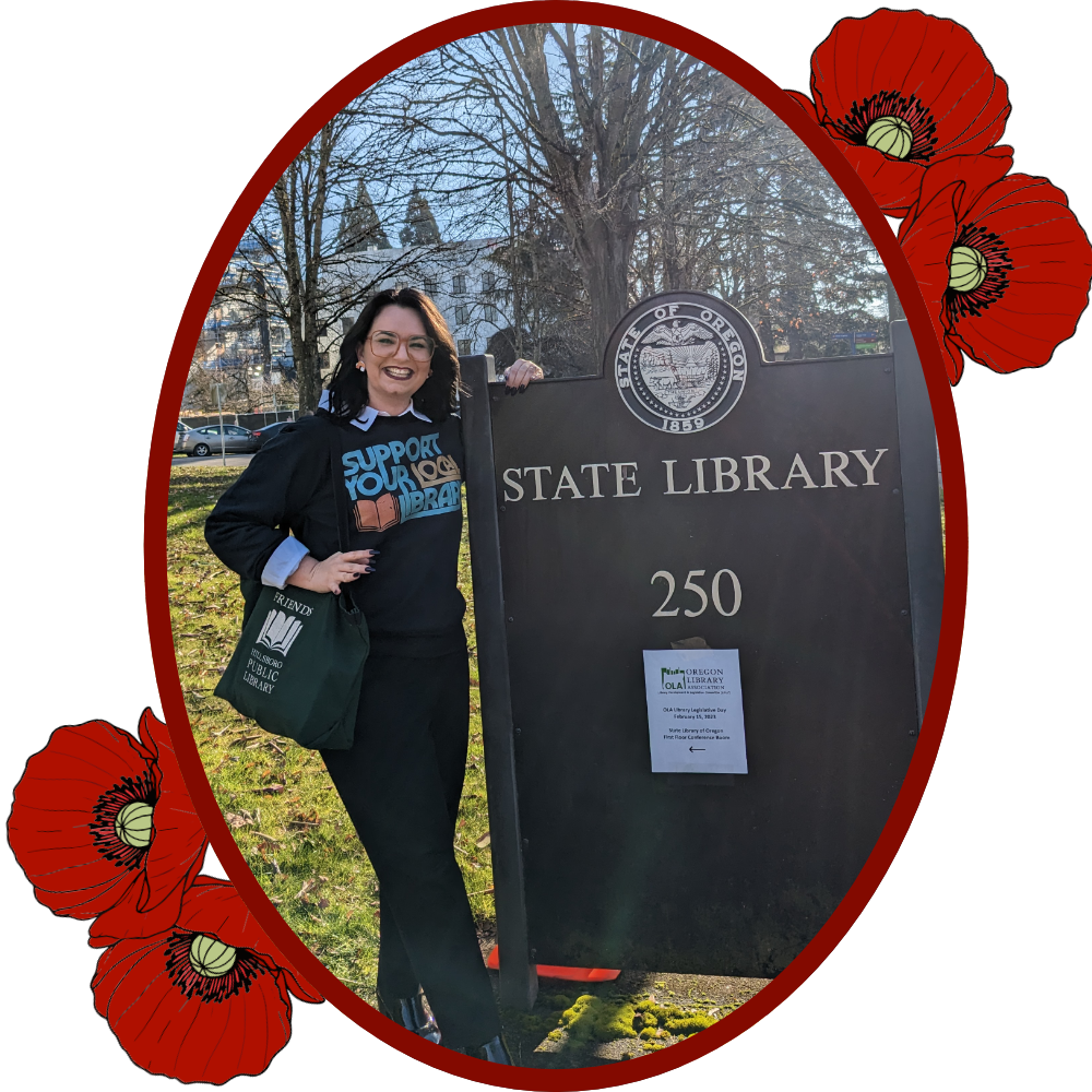 Photo: Dorian poses with State Library sign in Salem.